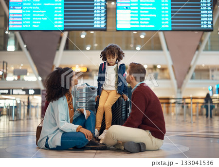 Family at airport, travel and wait with luggage, mother and father comfort sad child with flight delay and adventure. Terminal, journey and holiday with black woman, man with kid and interracial Family at airport, travel and wait with luggage, mother and father comfort sad child with flight delay and adventure. Terminal, journey and holiday with black woman, man with kid and interracial 133041536