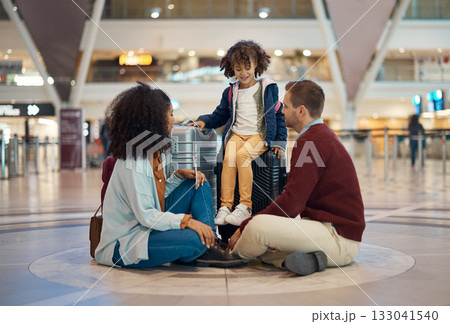 Family at airport, travel and waiting with luggage, mother and father with child, relax with flight delay and adventure. Terminal, journey and holiday with black woman, man and kid with suitcase Family at airport, travel and waiting with luggage, mother and father with child, relax with flight delay and adventure. Terminal, journey and holiday with black woman, man and kid with suitcase 133041540