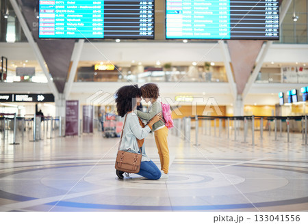 Black woman, girl kid and welcome in airport with head together, love or greeting with hug. Family, mother and daughter for reunion, embrace and happy for global travel, transportation or immigration Black woman, girl kid and welcome in airport with head together, love or greeting with hug. Family, mother and daughter for reunion, embrace and happy for global travel, transportation or immigration 133041556