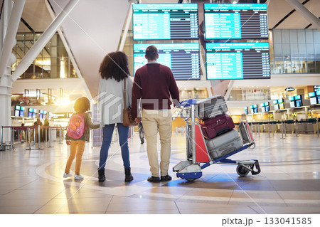 Family, holding hands and travel waiting at airport checking flight times for departure, trip or vacation together. Mom, father and child touching hand ready for traveling, immigration or holiday 133041585