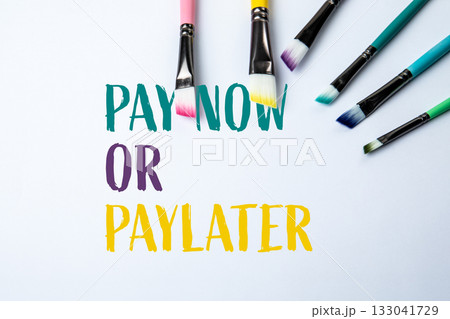Phrase pay now or pay later written on white background with colorful paintbrushes  133041729
