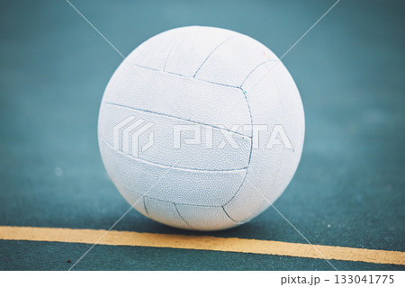 Netball on the floor on a sport court for a game, training or exercise outdoor on a field. Sports, fitness and white ball on the ground for a match, workout or practice competition by a outside arena 133041775
