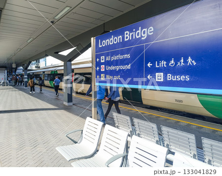 London Bridge Station platform signage with commuter trains in London, England, UK 133041829