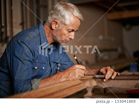 Carpentry, focus and man with pencil, table and creative work at furniture manufacturing workshop. Creativity, small business and professional carpenter working on sustainable wood project design. 133041869