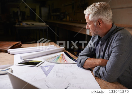 Man, senior architect and blueprint drawing in workshop, professional designer and engineering. Architecture design, floor plan paperwork on table with designing equipment and creative male engineer Man, senior architect and blueprint drawing in workshop, professional designer and engineering. Architecture design, floor plan paperwork on table with designing equipment and creative male engineer 133041870