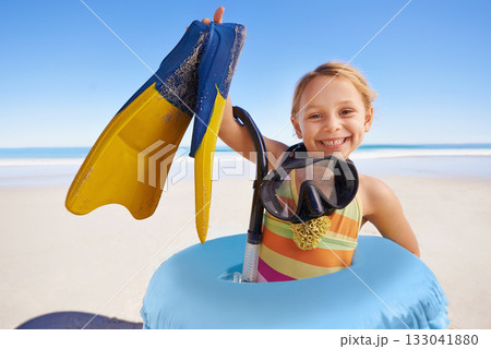 Beach, portrait and girl child with flippers, snorkel and inflatable swimming ring on ocean background. Face, happy and kid swimmer smiling, excited and ready for adventure while traveling in Miami Beach, portrait and girl child with flippers, snorkel and inflatable swimming ring on ocean background. Face, happy and kid swimmer smiling, excited and ready for adventure while traveling in Miami 133041880