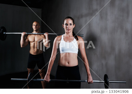 Fitness, people and weightlifting with barbell for exercise, bodybuilding or workout at gym. Portrait of fit, active and strong woman and man lifting weight for intense strength, muscle or training Fitness, people and weightlifting with barbell for exercise, bodybuilding or workout at gym. Portrait of fit, active and strong woman and man lifting weight for intense strength, muscle or training 133041906
