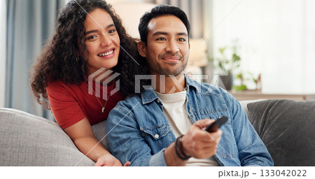 Man, woman and watching tv on sofa with remote, click and choice for movies, streaming or series in home. Happy couple, relax and television with care, bonding and love for film subscription at house Man, woman and watching tv on sofa with remote, click and choice for movies, streaming or series in home. Happy couple, relax and television with care, bonding and love for film subscription at house 133042022
