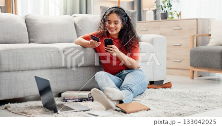 Woman, phone and credit card in living room for payment, online shopping or banking in home. Female person, student and smile with technology for bank app, ecommerce and purchase or subscription 133042025