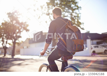 Bicycle, transport and man cycling in road with lens flare for exercise, commute and riding in morning. Travel, city and male cyclist on bike for eco friendly traveling, carbon neutral and journey 133042188