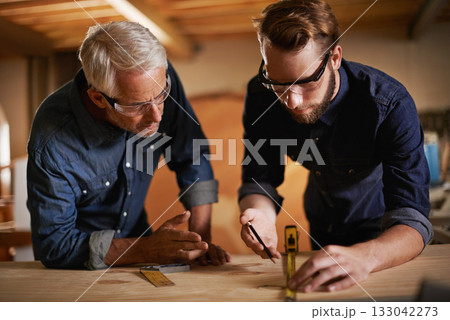 Carpentry, men and measurement in workshop teaching and learning furniture design, manufacturing or internship. Mentorship, carpenter or apprentice at sustainable wood business or teamwork on project Carpentry, men and measurement in workshop teaching and learning furniture design, manufacturing or internship. Mentorship, carpenter or apprentice at sustainable wood business or teamwork on project 133042273