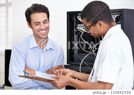 Server room, happy man or technician speaking of hardware maintenance or glitch in business office. Network, tech support or worker with electrician or electrical engineer for information technology 133042330