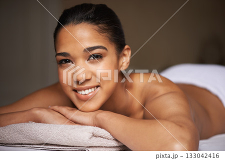 Happy woman, portrait or massage in hotel to relax for zen resting or wellness physical therapy in luxury resort. Face of girl smiling in salon for body healing treatment or natural holistic detox Happy woman, portrait or massage in hotel to relax for zen resting or wellness physical therapy in luxury resort. Face of girl smiling in salon for body healing treatment or natural holistic detox 133042416