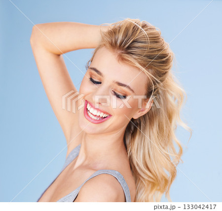 Hair, happy and woman with beauty, cosmetic treatment and hairstyle isolated on blue background. Haircare, happiness and keratin treatment with female model in studio with smile, skin and cosmetology Hair, happy and woman with beauty, cosmetic treatment and hairstyle isolated on blue background. Haircare, happiness and keratin treatment with female model in studio with smile, skin and cosmetology 133042417