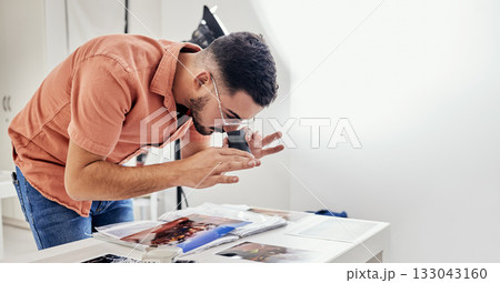 Photography, editing and man photographer in a studio working on fashion or creative images. Art, creativity and male analyzing pictures from a photoshoot at a digital, design or production agency. Photography, editing and man photographer in a studio working on fashion or creative images. Art, creativity and male analyzing pictures from a photoshoot at a digital, design or production agency. 133043160