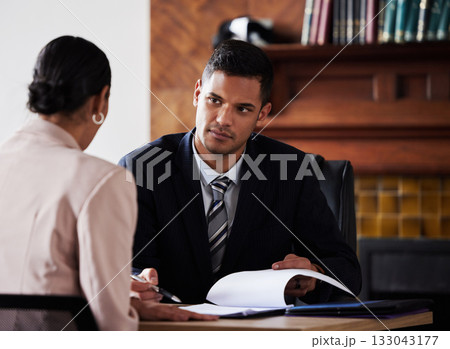 Contract, signature and attorney consulting a client in his office with legal paperwork or agreement. Signature, approval and male lawyer in discussion with woman with a document to sign in workplace 133043177