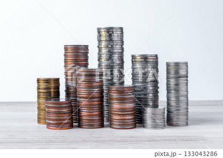 coins stacked on wooden with black background. Concept of saving 133043286