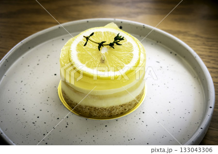Closeup of a homemade lemon tart decorated and lime slices Closeup of a homemade lemon tart decorated and lime slices 133043306
