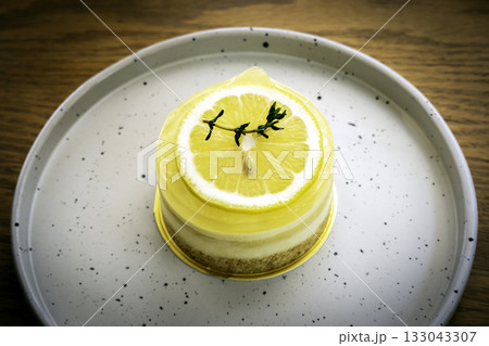 Closeup of a homemade lemon tart decorated and lime slices 133043307