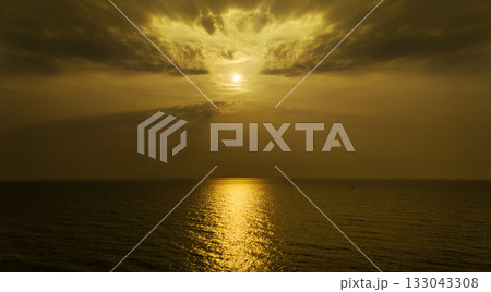 Background of sunset sky concept : Sunset or sunrise with clouds on sea 133043308