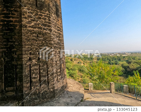 Ancient stone wall and path of Sangni Fort in Pakistan heritage site 133045123