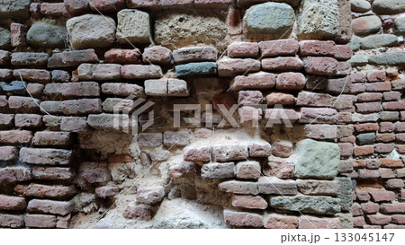 Closeup of spider webs inside old historical fort wall Closeup of spider webs inside old historical fort wall 133045147