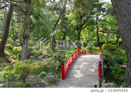 Red bridge in Shukkei-en Japanese garden in Hiroshima, Japan 133045830