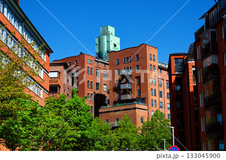 Houses in Eriksberg district, former shipyard near Alvsborg bridge, Hisingen island, sunny day in Gothenburg, Sweden Houses in Eriksberg district, former shipyard near Alvsborg bridge, Hisingen island, sunny day in Gothenburg, Sweden 133045900