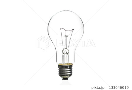 A light bulb is lit up and is the only thing in the image 133046019