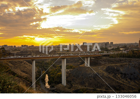 A bridge spans a river with a city in the background A bridge spans a river with a city in the background 133046056