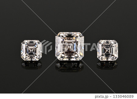 Three white diamonds are displayed on a black background Three white diamonds are displayed on a black background 133046089