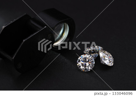 Three diamonds are on a black background Three diamonds are on a black background 133046096