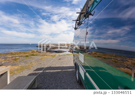 Camper car on norwegian sea coast 133046551