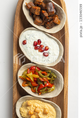 Assorted mediterranean appetizers on wooden board 133046599