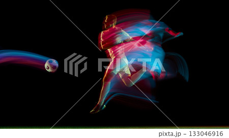 Soccer player running and kicking ball with red and cyan neon motion streaks Soccer player running and kicking ball with red and cyan neon motion streaks 133046916