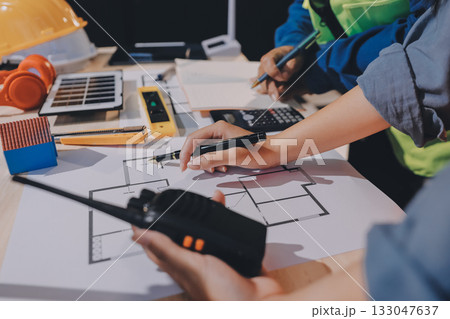 Architects and engineers working collaboratively on construction project 133047637