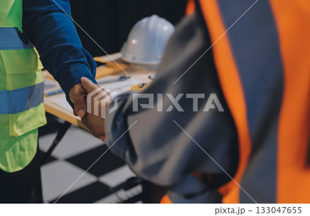 Architects and engineers working collaboratively on construction project 133047655