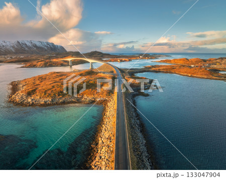 Aerial view of the Fredvang bridge and coastal road at sunset Aerial view of the Fredvang bridge and coastal road at sunset 133047904