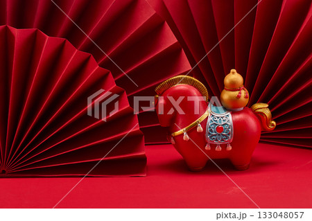 Lunar New Year 2026. New Year background. Red Paper Fans and Horse Figurine Lunar New Year 2026. New Year background. Red Paper Fans and Horse Figurine 133048057