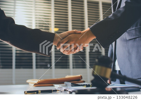 Lawyer explained to the client about the law that must be brought against the court case. Lawyer explained to the client about the law that must be brought against the court case. 133048226