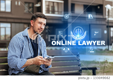 Young man using smartphone to consult an online lawyer in a modern urban setting Young man using smartphone to consult an online lawyer in a modern urban setting 133049082