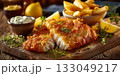Fish and chips meal in restaurant 133049217