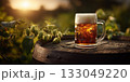 Pint of delicious cold beer in a mug in hop plantation 133049220