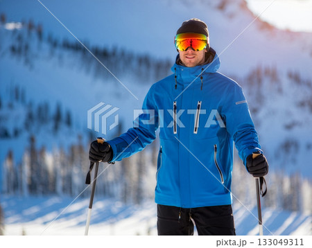 Snowy mountain adventure with a skier enjoying the winter landscape in bright blue gear during a sunny day in the mountains Snowy mountain adventure with a skier enjoying the winter landscape in bright blue gear during a sunny day in the mountains 133049311