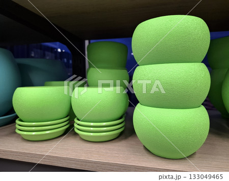 Green ceramic flower pots on supermarket shelf, sold at flower shop 133049465