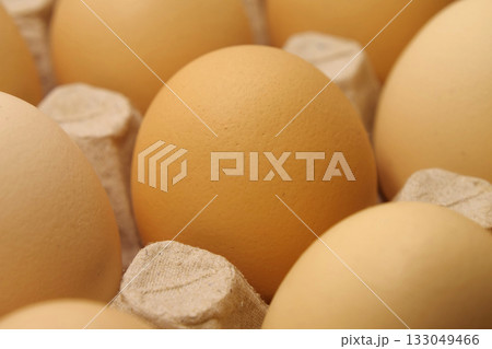 Fresh yellow chicken eggs in tray 133049466