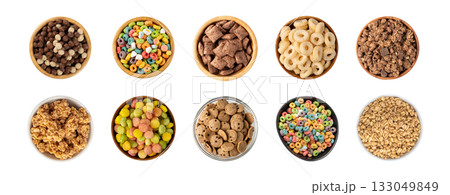 Assorted breakfast cereal piles isolated. Corn flakes mix, various granola food Assorted breakfast cereal piles isolated. Corn flakes mix, various granola food 133049849