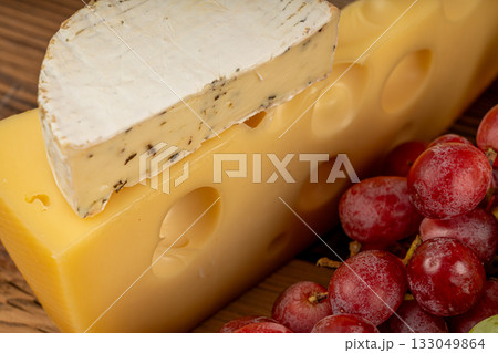 Cheese plate of color cheeses variety, yellow, Maasdam cheese board, assorted dairy products 133049864