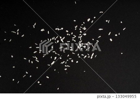 Grated coconut powder. Dry coco flakes pile, shredded desiccated coconut, tropical fruit chips Grated coconut powder. Dry coco flakes pile, shredded desiccated coconut, tropical fruit chips 133049955