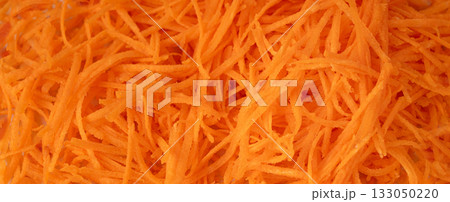 Fresh Finely Grated Carrots Textured Background, Raw Carrot Pieces Closeup Pattern Fresh Finely Grated Carrots Textured Background, Raw Carrot Pieces Closeup Pattern 133050220